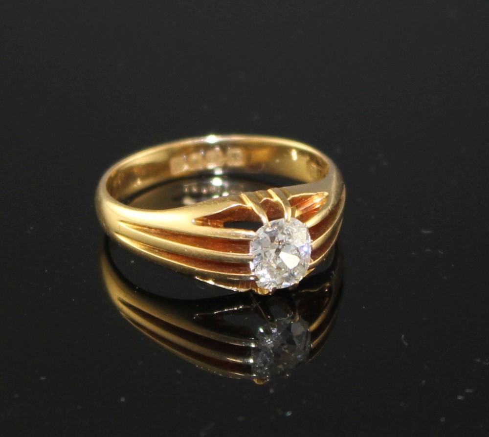 An Edwardian 18ct gold and claw set solitaire oval cut diamond ring, size P/Q, gross weight 5.1 grams.